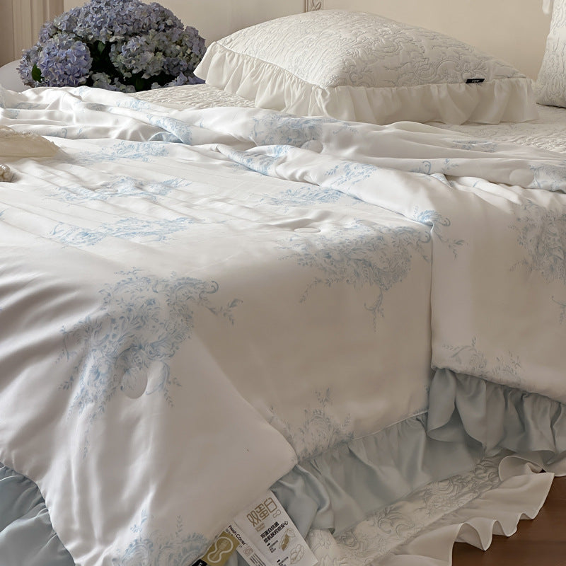 Quilted bedspread with ruffle and reversible satin bedding set