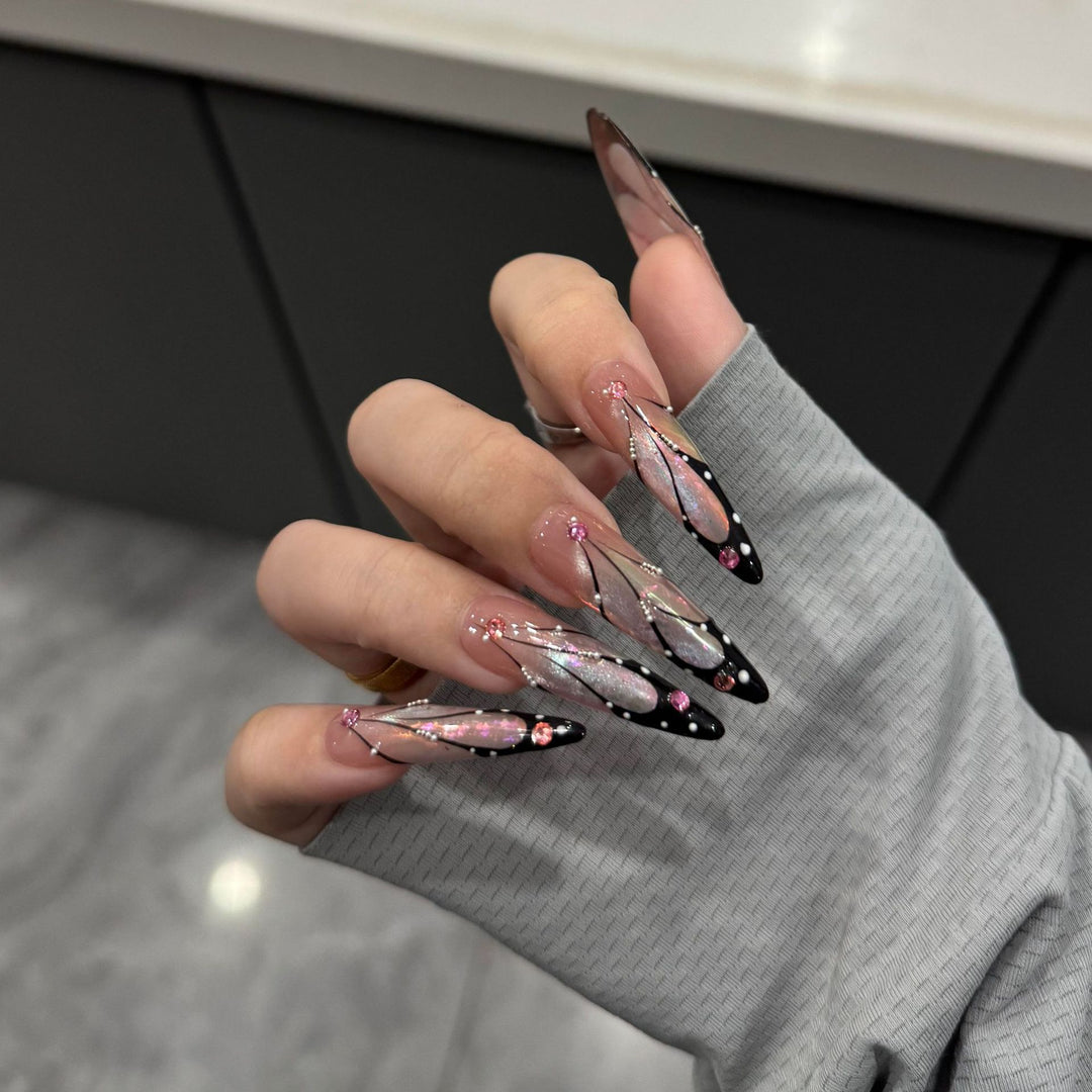 Artifical nail tips with elegant designs and glitter accents Stornfield