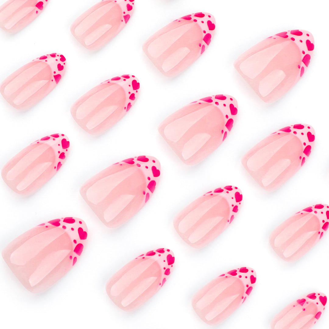 Artificial nail extensions with heart tip accents Stornfield