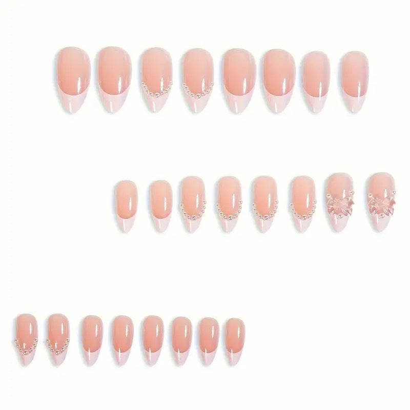 Art nail tips with delicate pearl and butterfly accents Stornfield