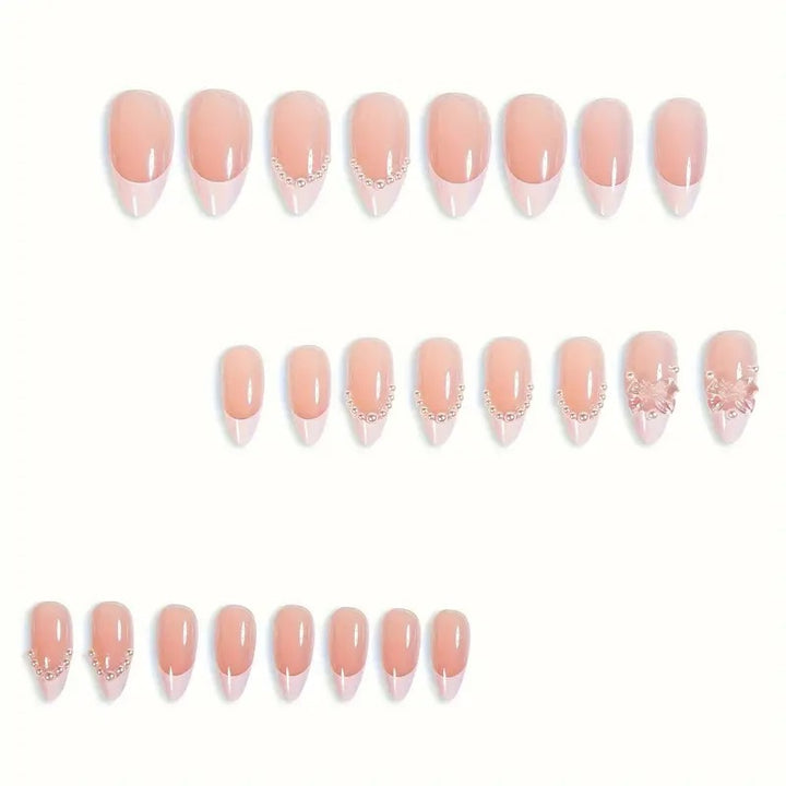 Art nail tips with delicate pearl and butterfly accents Stornfield