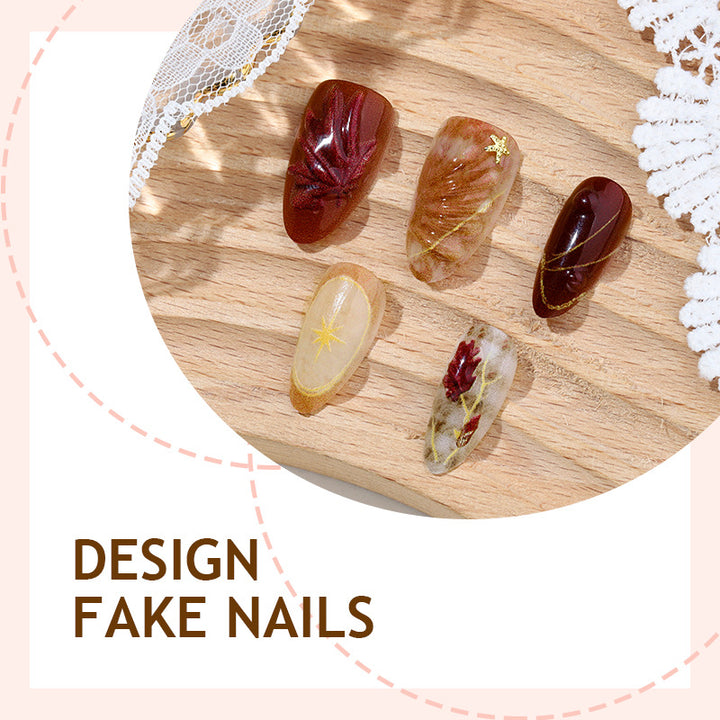 Nail set with elegant flower and glitter accents Stornfield