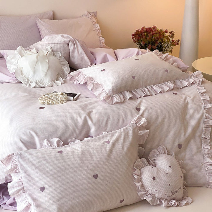 Romantic bedding set made of cotton satin with ruffles and heart print