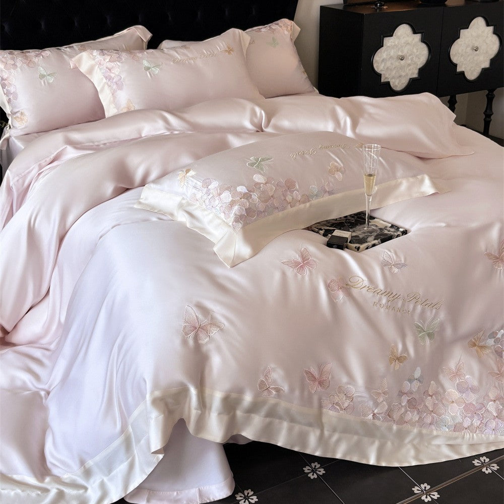 Luxurious satin bedding set with embroidered butterfly and flower appliqués
