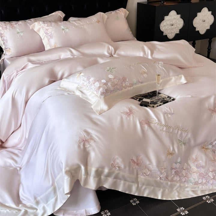 Luxurious satin bedding set with embroidered butterfly and flower appliqués