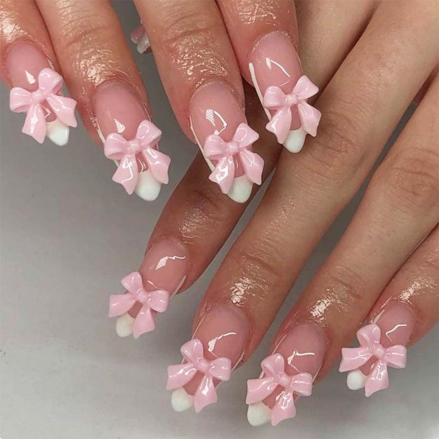 Nail art set with playful bow accents Stornfield