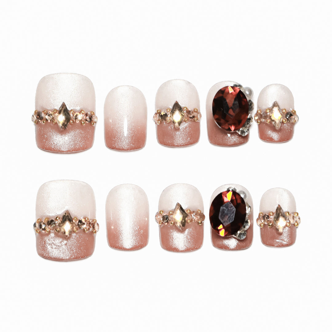 Artificial nail art with glitter and jewelry embellishments Stornfield