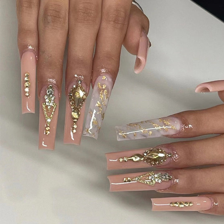 Artful nail extensions with glitter embellishments and delicate accents Stornfield