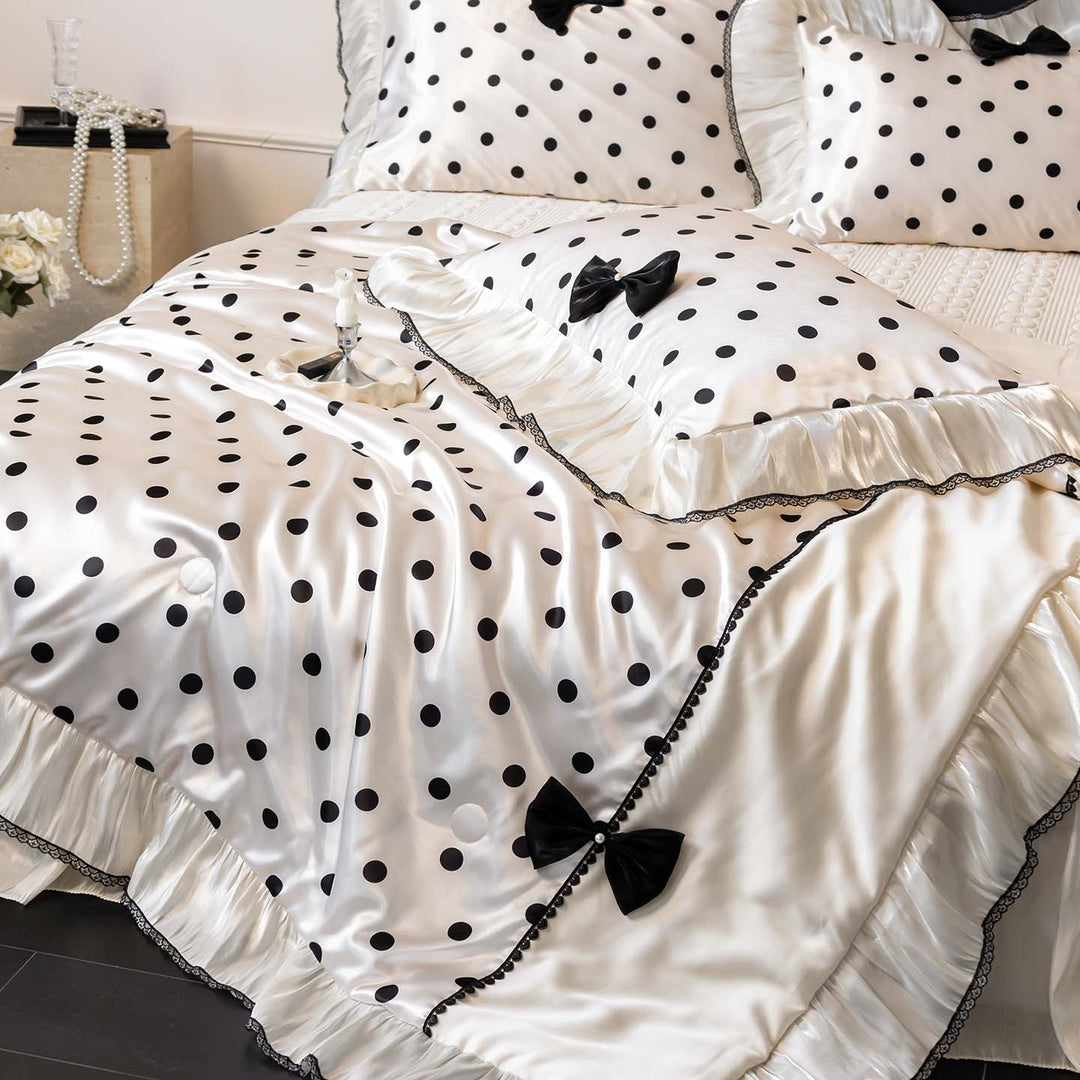 Romantic polka dot satin bedding set with ruffles and decorative ribbons