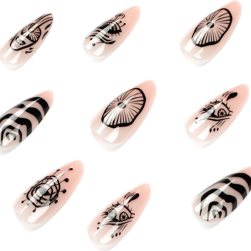 Artistic acrylic nails in elegant stiletto design with graphic patterns Stornfield