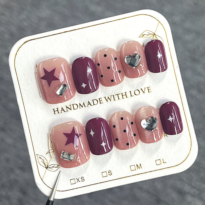 Artificial nail extensions with unique jewelry accents Stornfield