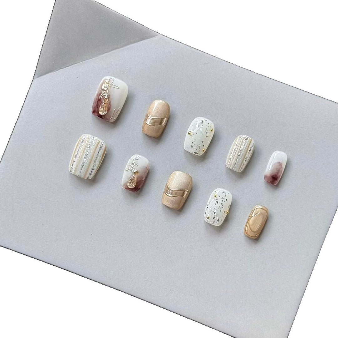 Elegant Decorative Press-On Nail Set with Gold and Marble Accents