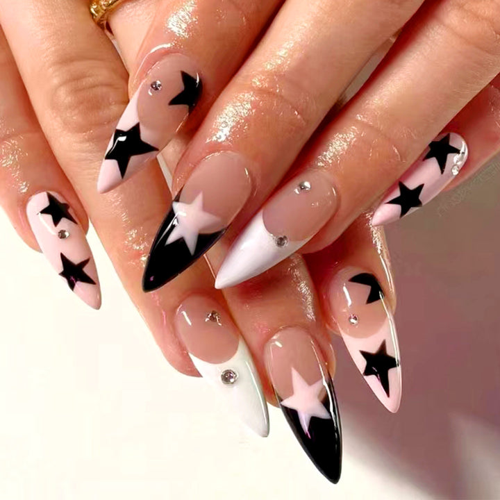 Artistic stiletto nails with star motif Stornfield