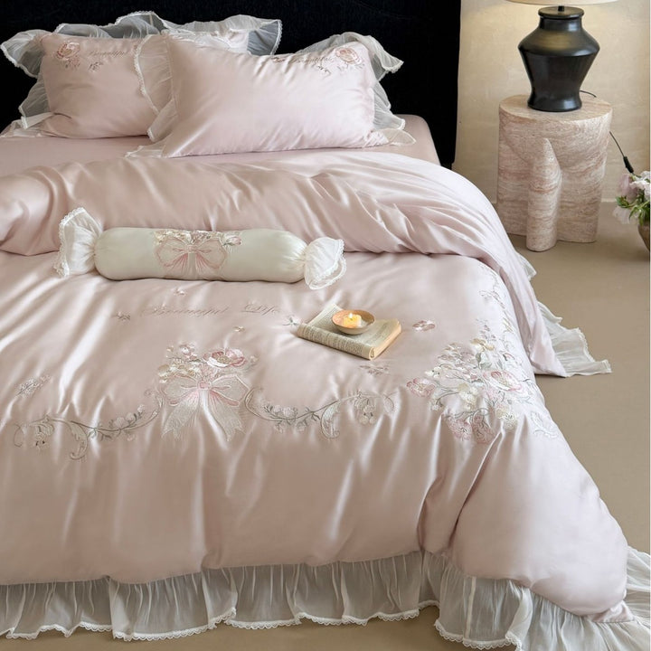Embroidered satin bedding set with frill, ruffles, and decorative pillow