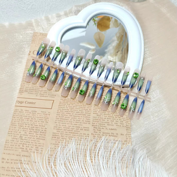 Artificial nails with elegant gradient color and glitter accents Stornfield