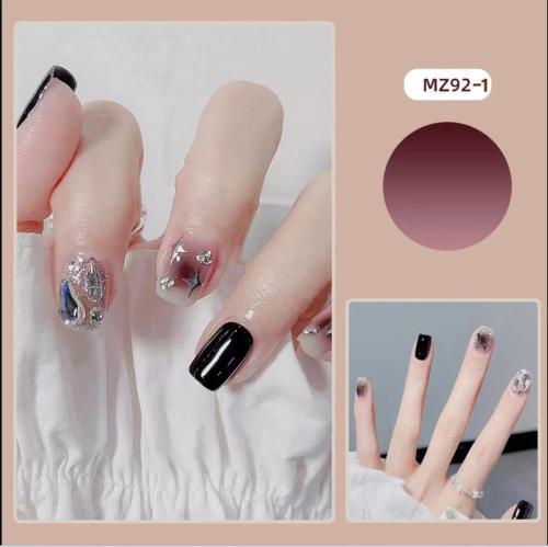 Elegant nail design with bow and rhinestone details Stornfield