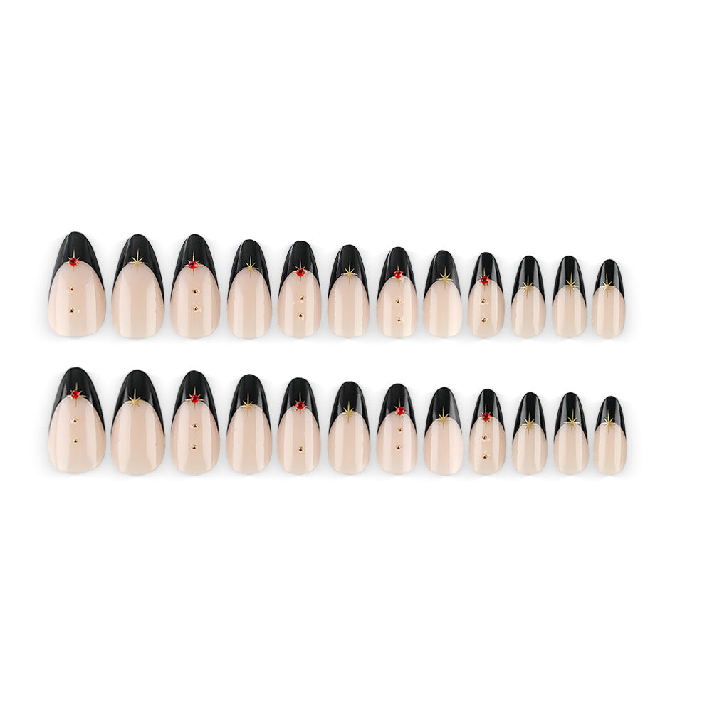 Glamorous artificial nails in stylish stiletto design with golden accents Stornfield