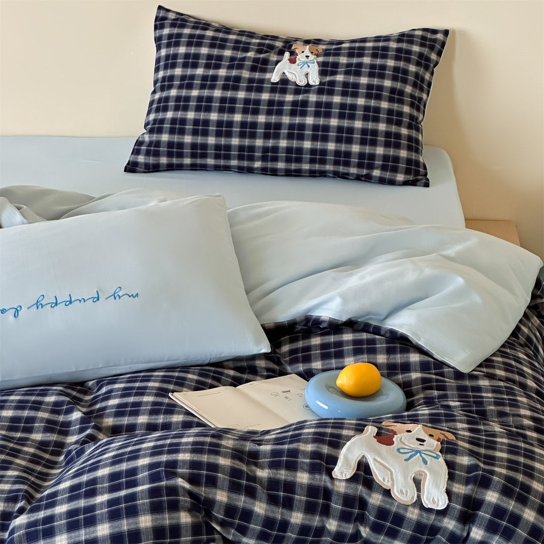 fine striped bed linen set with embroidered cat motif and soft cotton satin