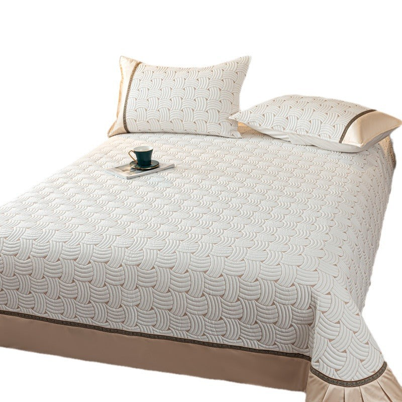 Quilted bedspread set with satin ruffle and geometric wave relief
