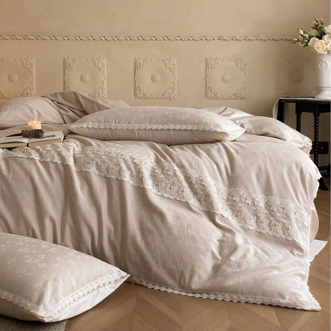 Embroidered cotton satin bed linen set with lace ruffle and subtle jacquard relief