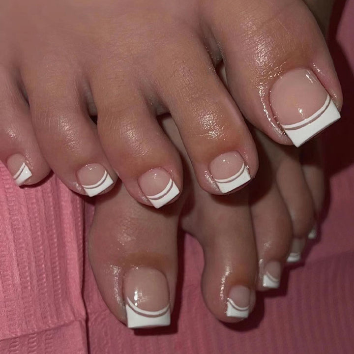 Artful toenail art with elegant French tip design Stornfield