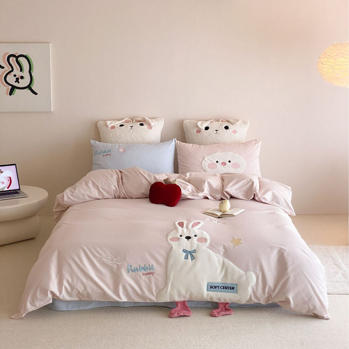 Children's bedding set with appliquéd duck figure, embroidered details, and extra soft microfiber cover