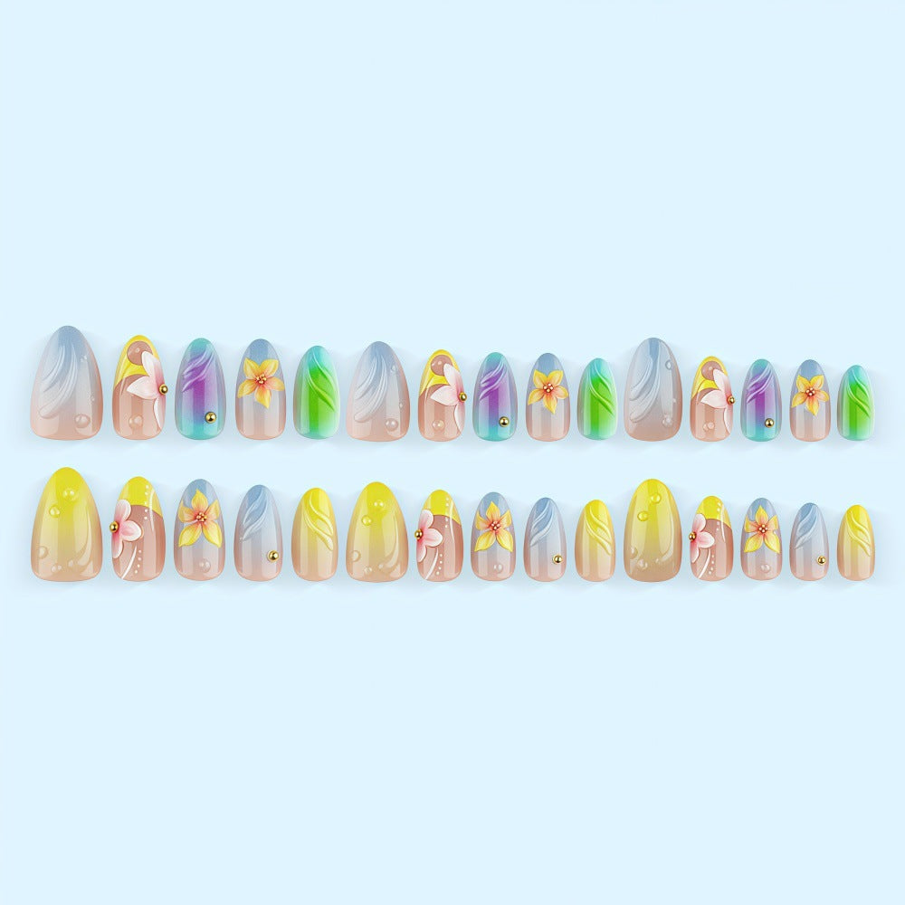 Acrylic nail set with floral elements and colorful accents Stornfield