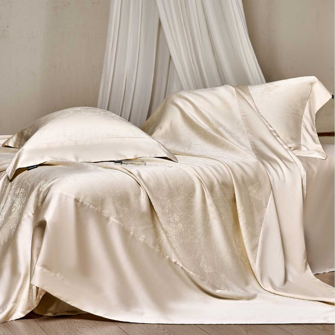 Satin bed linen set with floral jacquard texture and fine hem detail