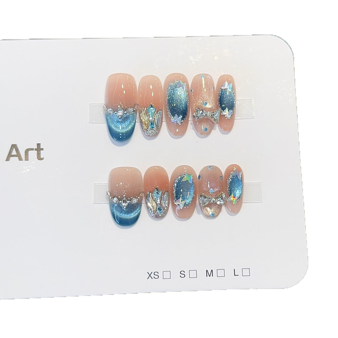 Artificial nail tips with glitter and watercolor effect Stornfield