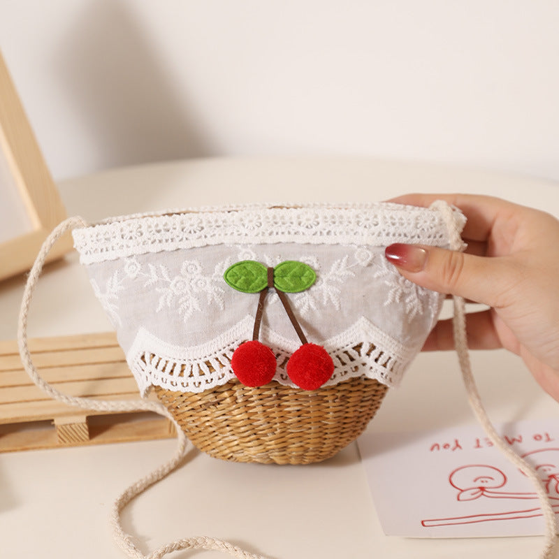 Playful straw shoulder bag with floral accents Stornfield
