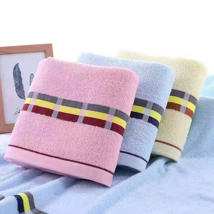 Women’s terry bath towel with elegant striped border Stornfield