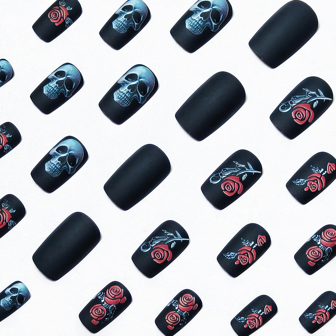 Creative nail art with skull and rose designs Stornfield