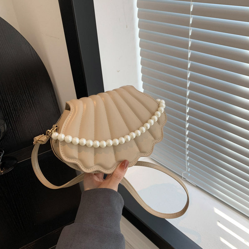 Elegant Pearl-Handled Clutch