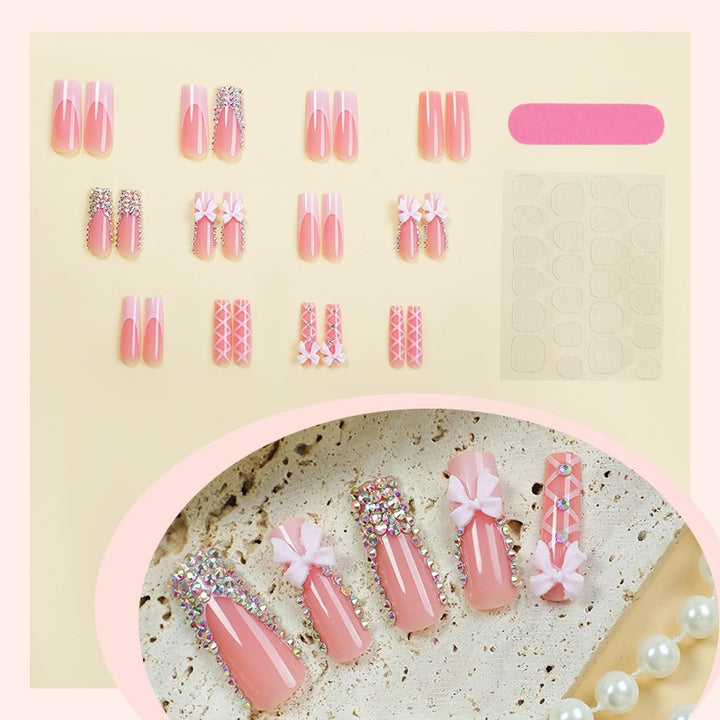 Artificial nail set with glitter and bow motif Stornfield