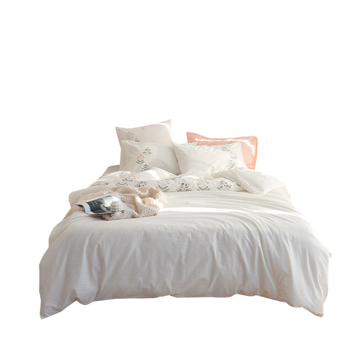 Embroidered cotton muslin bedding set with delicate flower appliqués and extra soft fitted sheet