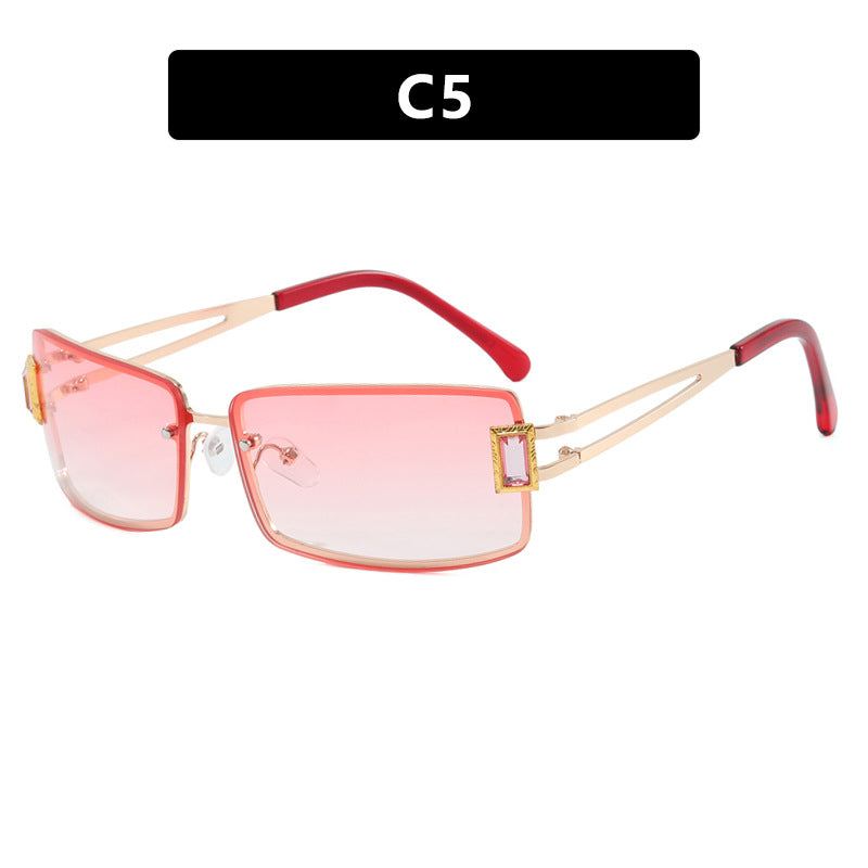 Ladies stylish sunglasses with elegant trapezoidal lenses and filigree metal frame Stornfield