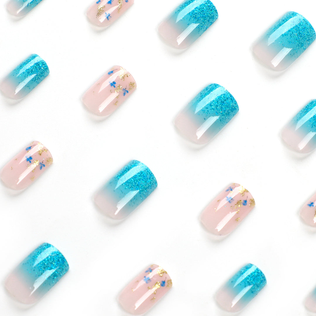 Artful acrylic nails with floral design and glitter effects Stornfield