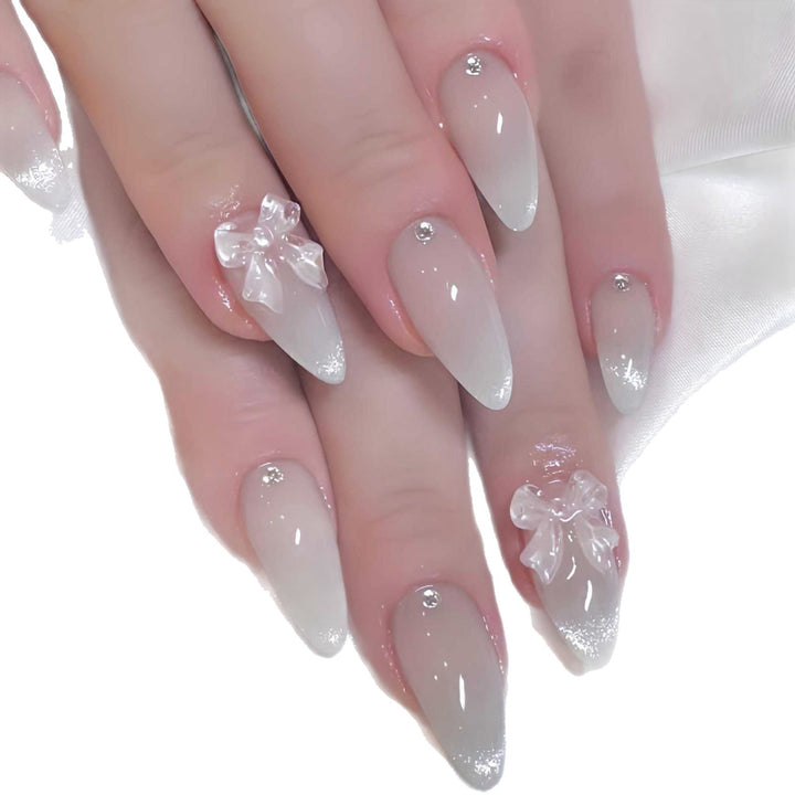Elegant Stiletto-Shaped Press-On Nails with Decorative Bow Accents Stornfield