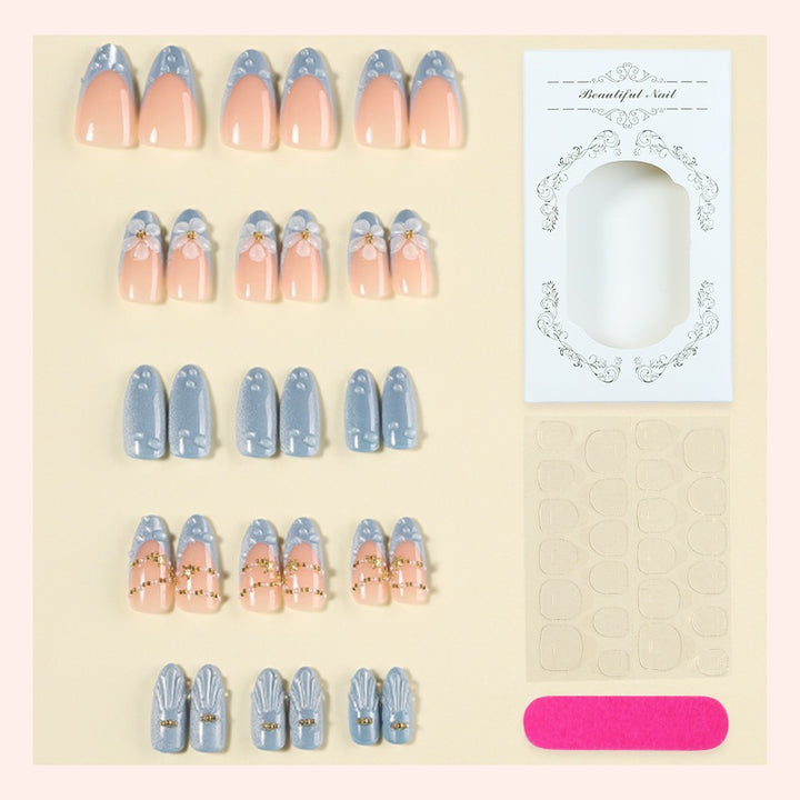 Creative acrylic nail set with elegant flower and glitter accents Stornfield