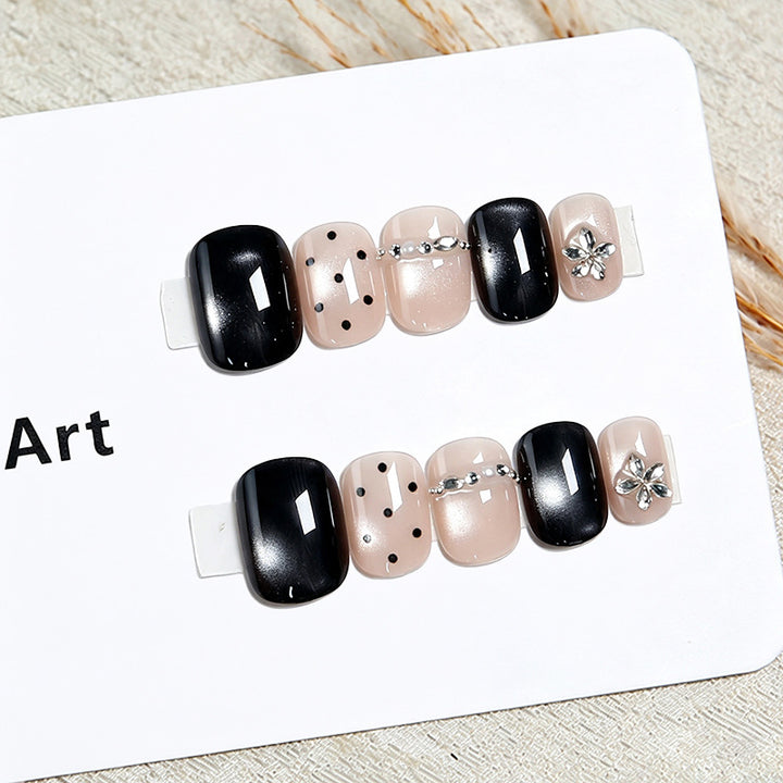 Acrylic nail set with glamorous accents and delicate designs Stornfield