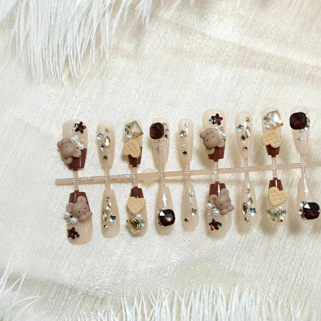 Creative acrylic nails with animal motifs and glitter accents Stornfield