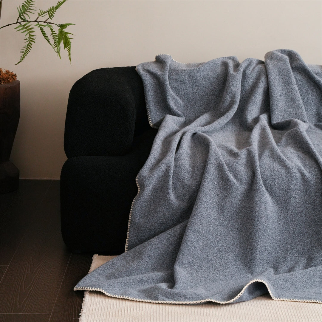 Premium wool blanket with fine hand-stitched edge and particularly soft drape