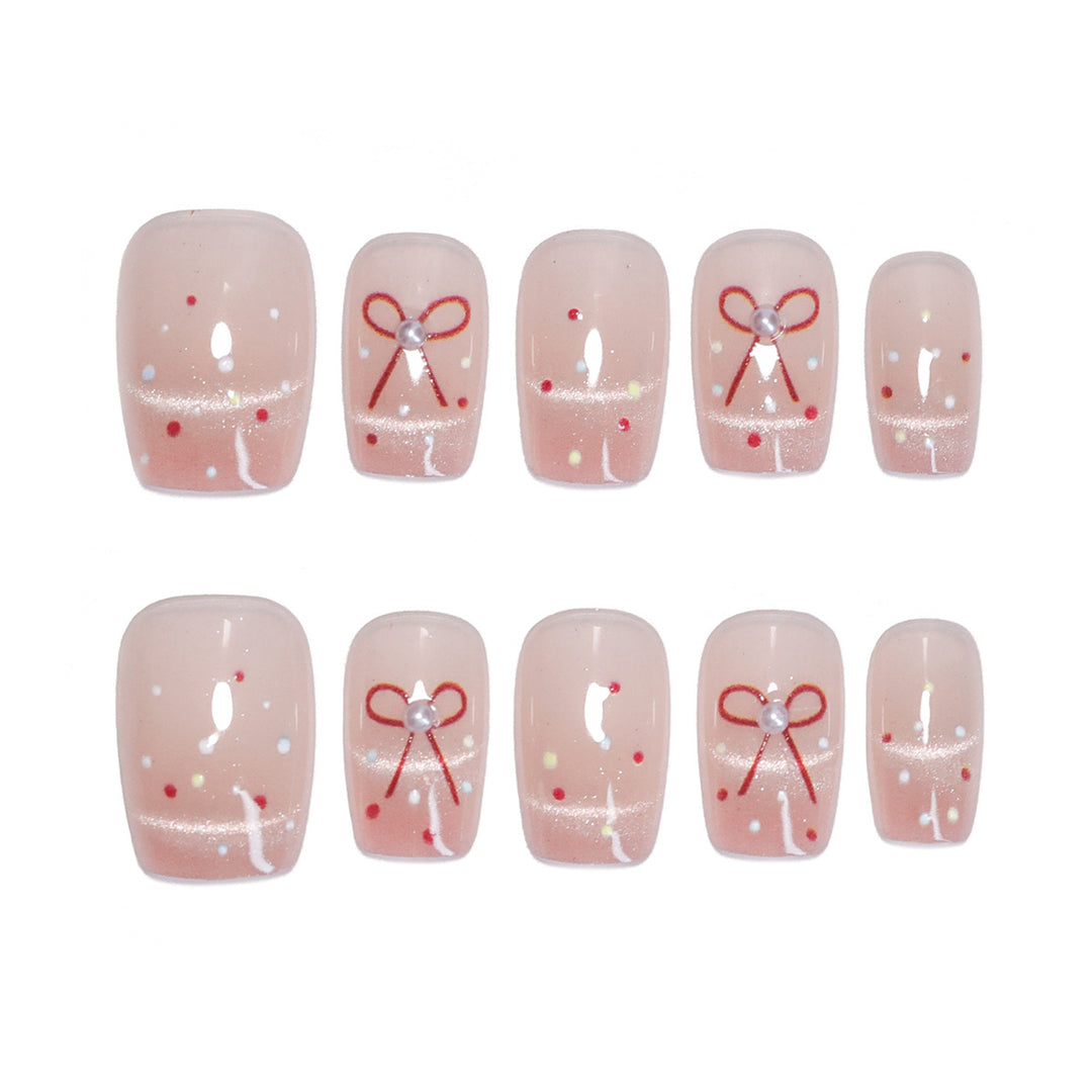 Artificial nail art with elegant bows and glitter accents Stornfield
