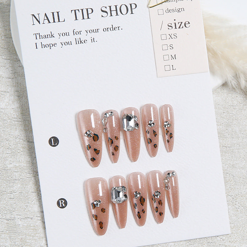 Glamorous artificial nail set with fun leopard pattern and glittering accents Stornfield