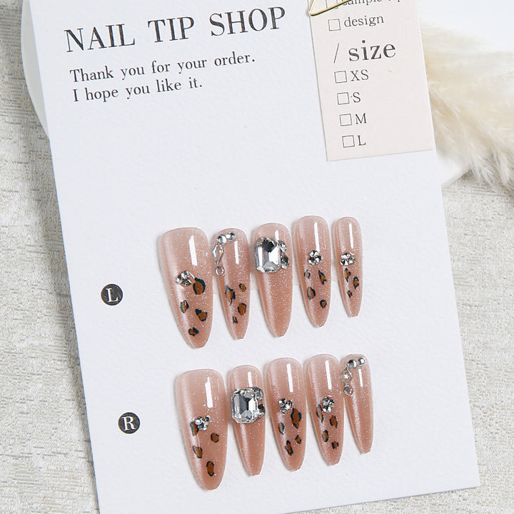 Glamorous artificial nail set with fun leopard pattern and glittering accents Stornfield