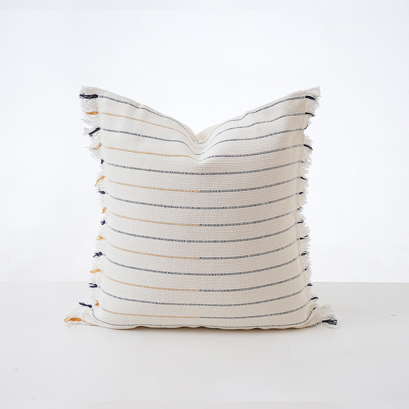 Structured square decorative pillow with crocheted trim and striped knit texture