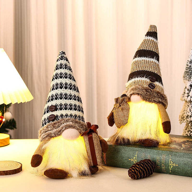 Decorative Christmas gnome with gift package Stornfield
