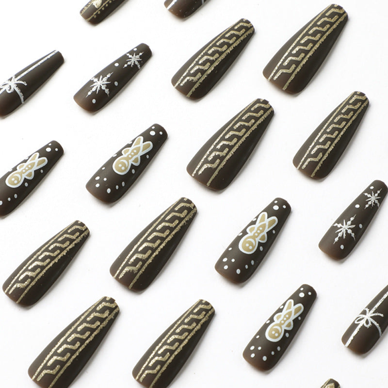 Artificial nail art with festive gingerbread design Stornfield