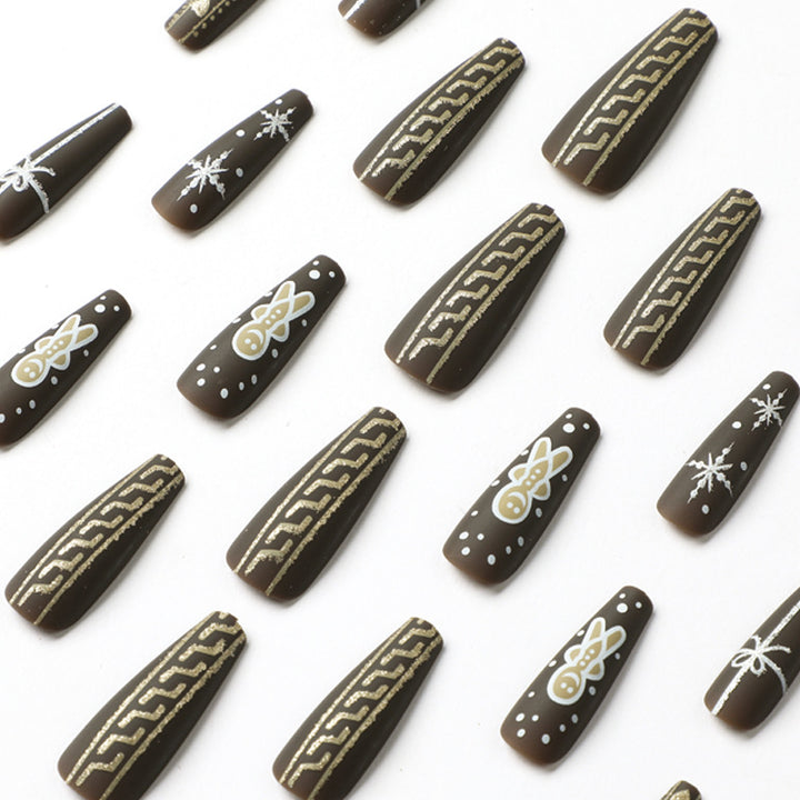 Artificial nail art with festive gingerbread design Stornfield