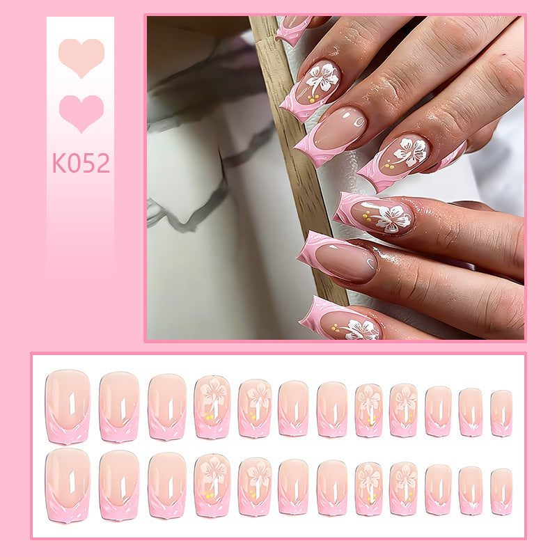 Artificial nails with floral designs and elegant shape Stornfield